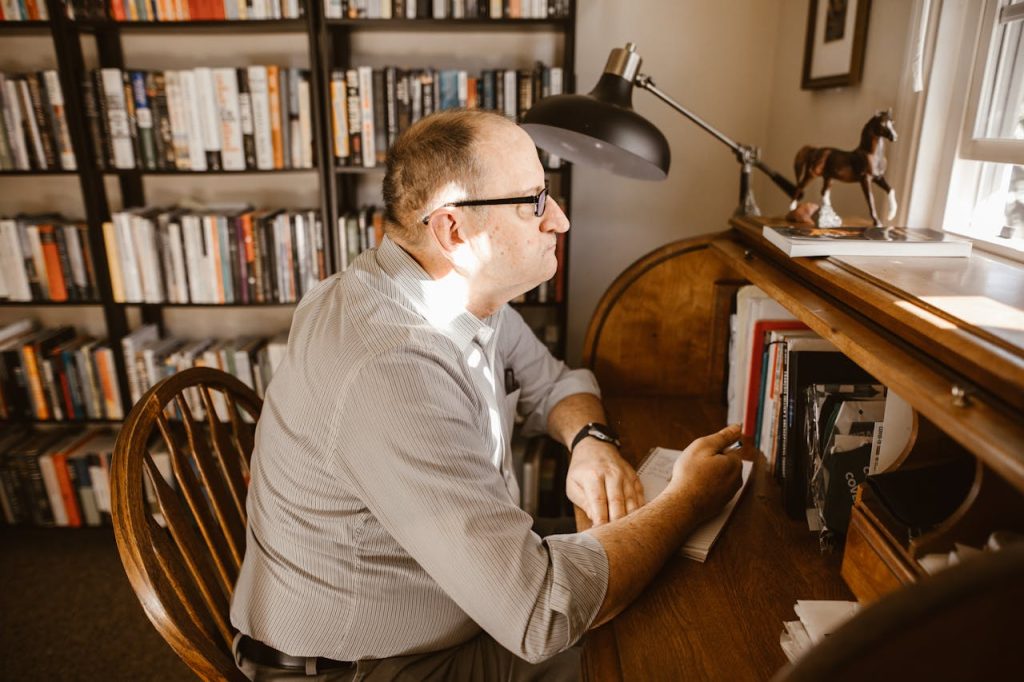 old man working on a desk